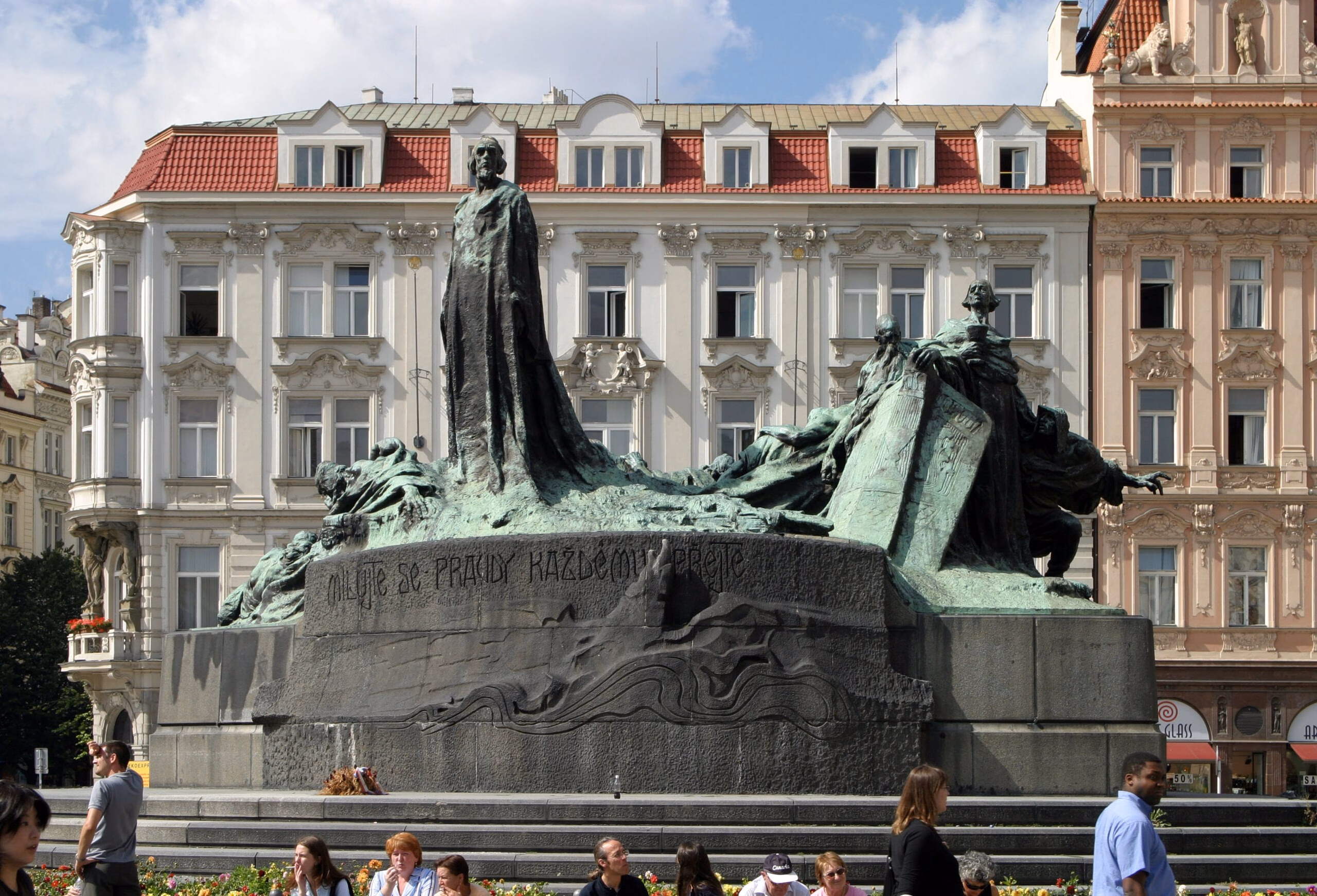 Prague_hus_statue Statue of Jan Hus in Old Town Square, Prague, with the inscription "Milujte se, pravdy každému přejte" (Love one another and wish the truth to everyone), commemorating the Czech reformer and national hero. Jan Hus Day is on the 6th of July.